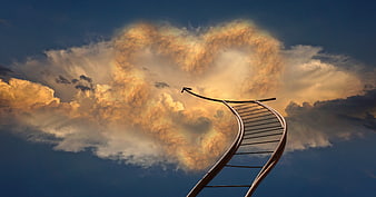 Metal ladder reaching into heart-shaped golden clouds