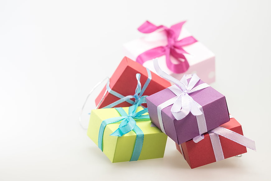 Colorful Gift Boxes With Ribbons On White Background