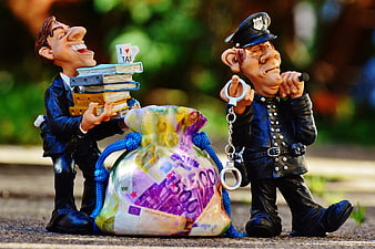 Tax Evasion Concept with Figurines and Money Bag