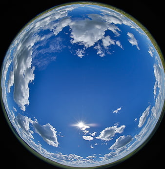 Fisheye Lens Blue Sky with White Clouds and Sunburst