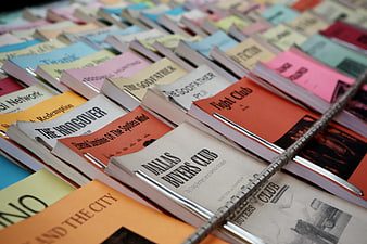 Colorful Movie Scripts and Screenplays in a Wire Basket