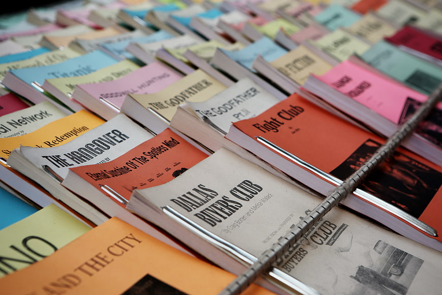Colorful Movie Scripts and Screenplays in a Wire Basket