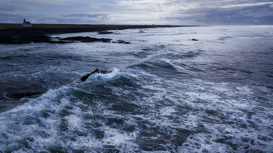 Dramatic Ocean Waves Crashing on Rocky Icelandic Coastline