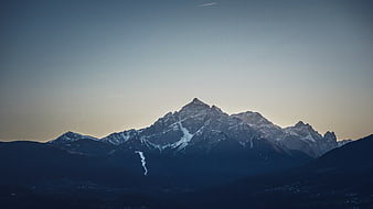 Majestic Snow-Capped Mountain Peak at Dusk