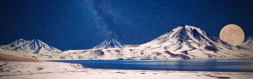 Snowy Mountains and Lake Under Starry Night Sky with Full Moon
