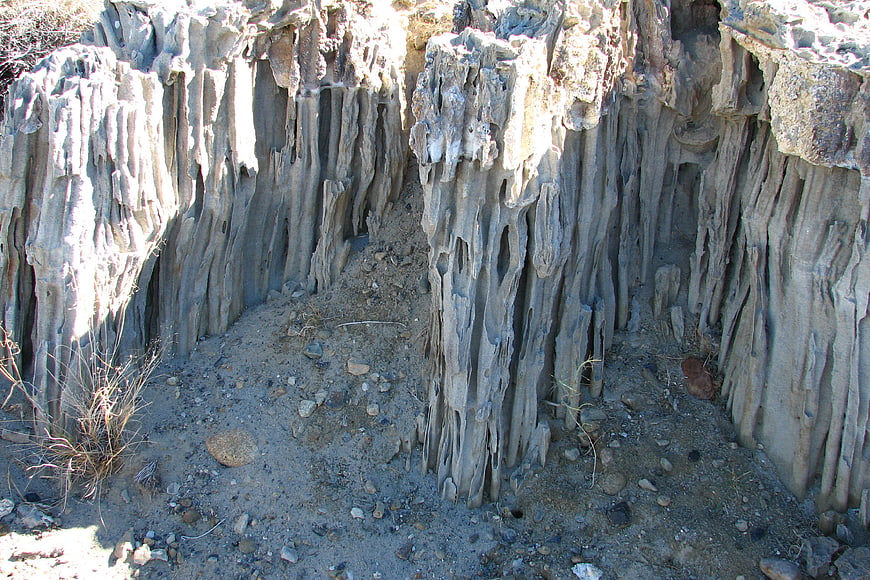 Eroded vertical rock formations in desert landscape