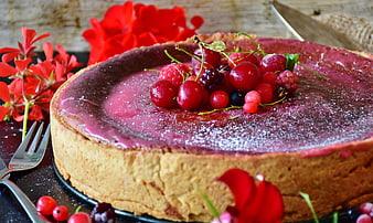 Rustic berry cheesecake with fresh cherries and red flowers