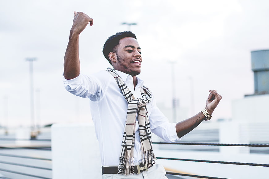 Happy African American Man Dancing on Rooftop