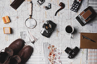 Vintage Travel Flat Lay With Camera, Map, Coffee, and Leather Boots