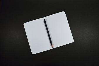 Minimalist White Notebook and Pencil on Black Background