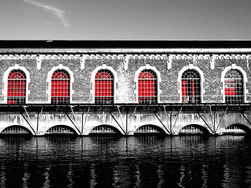 Black and white architecture with selective red window color