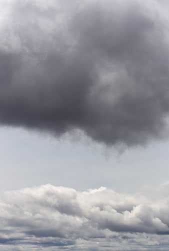 Dramatic Dark Storm Clouds Over Bright Sky