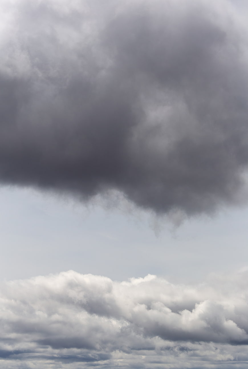 Dramatic Dark Storm Clouds Over Bright Sky