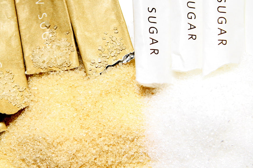 Brown and White Sugar Packets with Granulated Piles