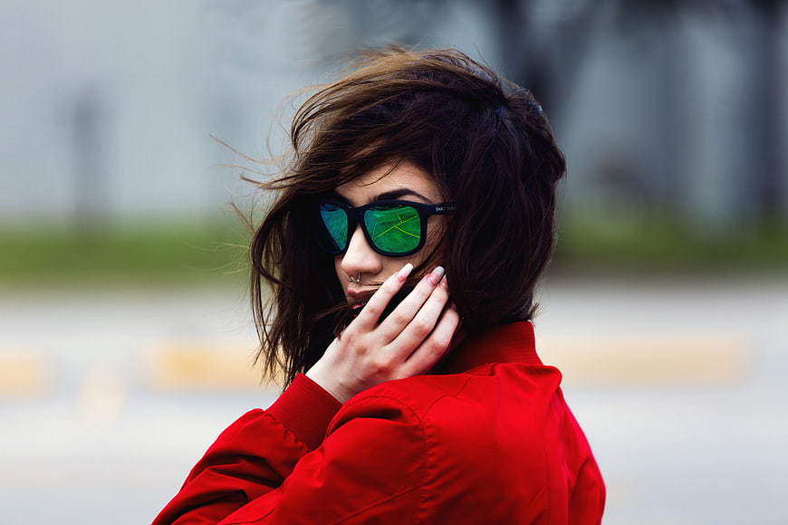 Woman in Red Jacket with Green Sunglasses