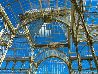 Low angle view of glass and metal arched roof structure