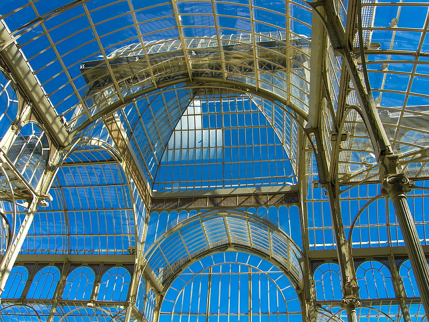 Low angle view of glass and metal arched roof structure