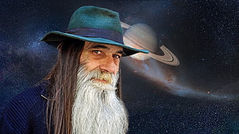 Senior man with long white beard and hat against space background