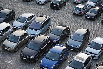 Aerial View of Parked Cars in Urban Cobblestone Parking Lot