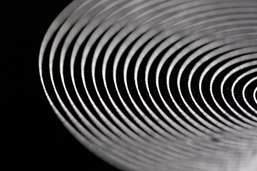Abstract black and white concentric spiral pattern background