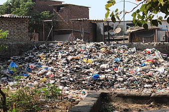 Large pile of garbage and trash in urban slum area