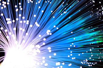 Blue Fiber Optic Cables Radiating Light on Black Background