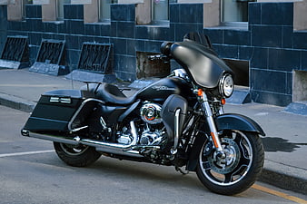 Black Harley-Davidson Motorcycle Parked on City Street