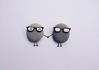 Cute Stone Characters with Glasses Holding Hands