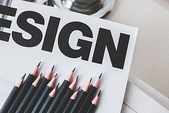 Black pencils on design magazine with copyspace