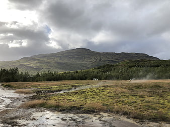 Icelandic Geothermal Landscape with Mountain and Steam