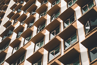 Modern apartment building facade with wooden balconies