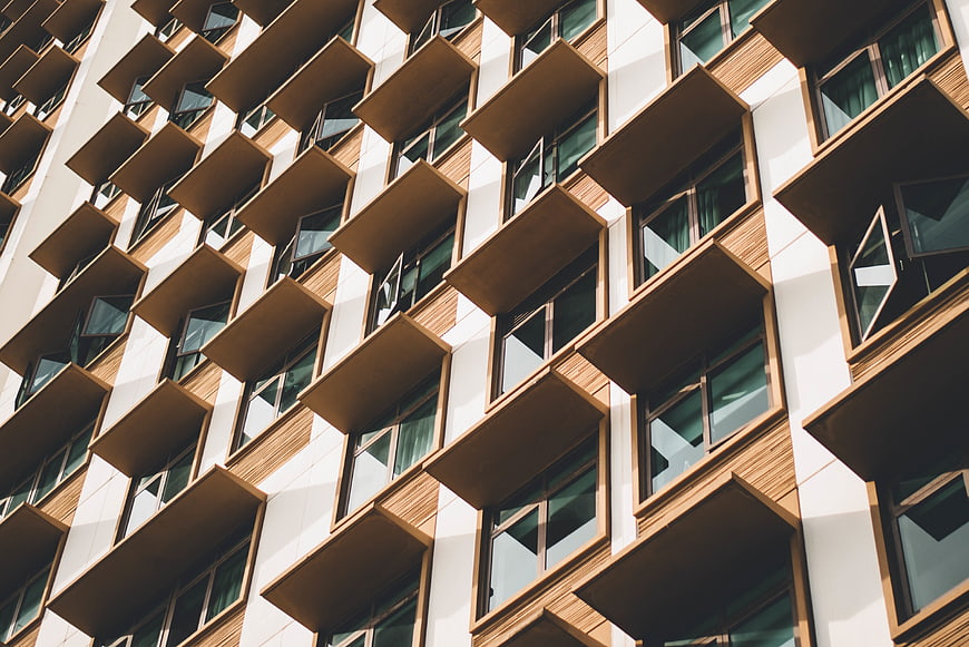 Modern apartment building facade with wooden balconies