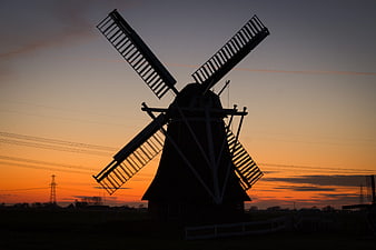 Silhouette of Traditional Windmill at Sunset