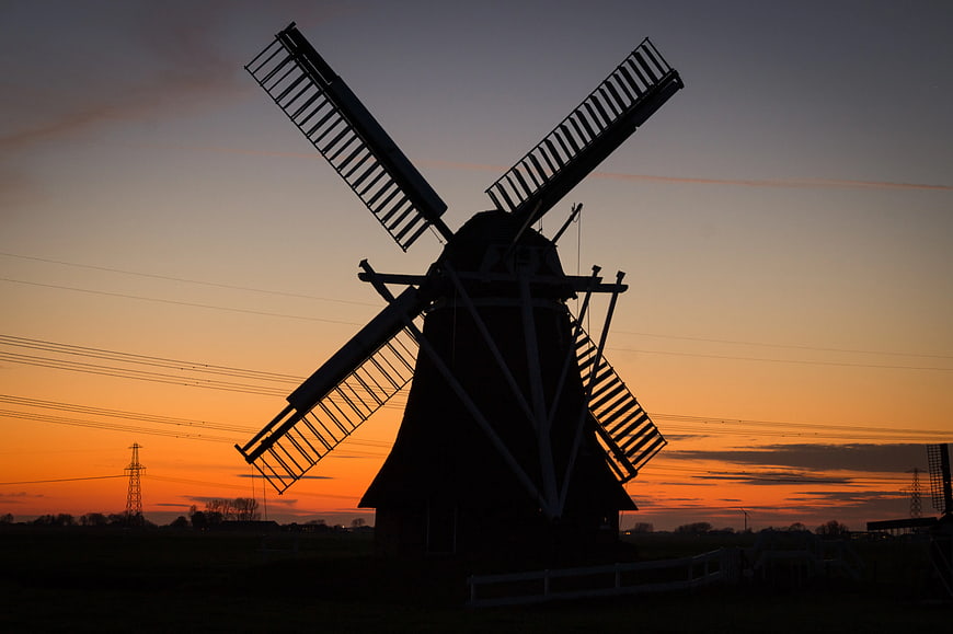 Silhouette of Traditional Windmill at Sunset