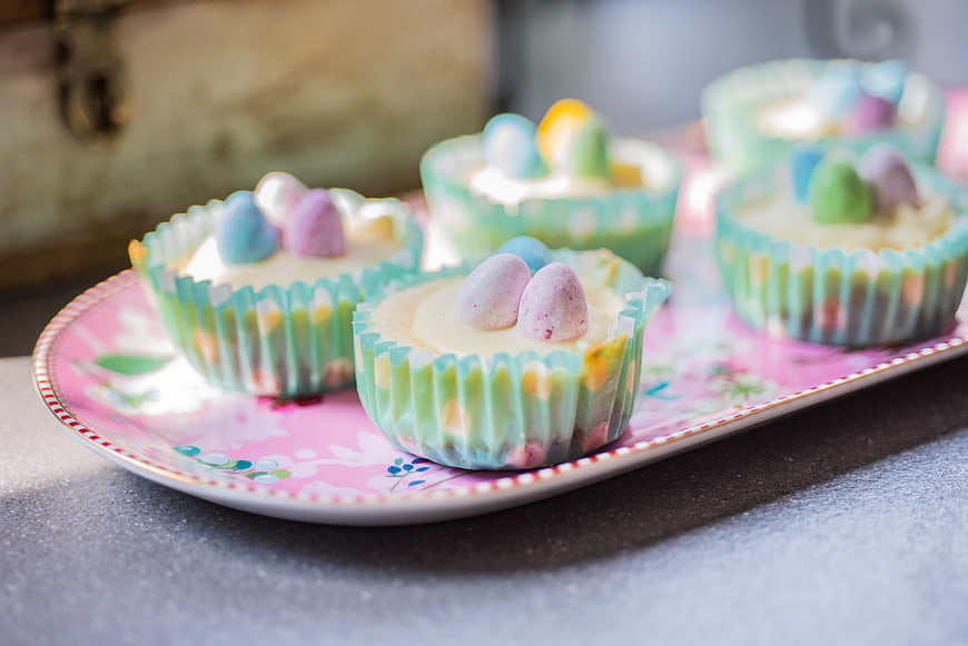 Pastel Easter Cupcakes with Mini Eggs on Floral Plate