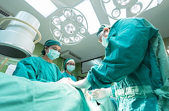 Medical Team Performing Surgery In Modern Operating Room