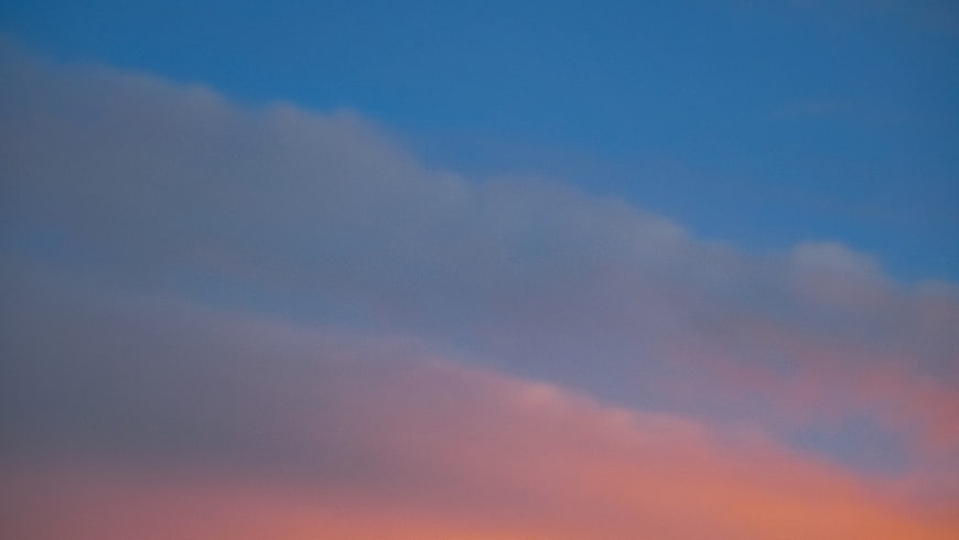 Soft Pink and Blue Sunset Clouds Sky Background
