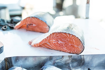 Fresh Salmon Steaks on White Cutting Board