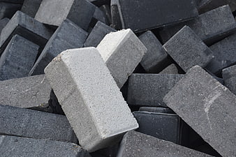 Pile of gray concrete blocks and masonry bricks