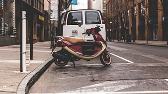 Red and Cream Scooter Parked on Urban City Street