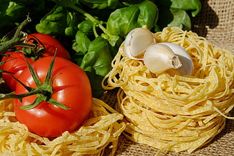 Fresh Italian pasta ingredients with tomatoes, basil, and garlic