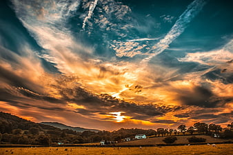 Dramatic Sunset Over Rolling Countryside Hills