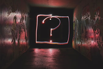 Neon question mark light painting in graffiti tunnel