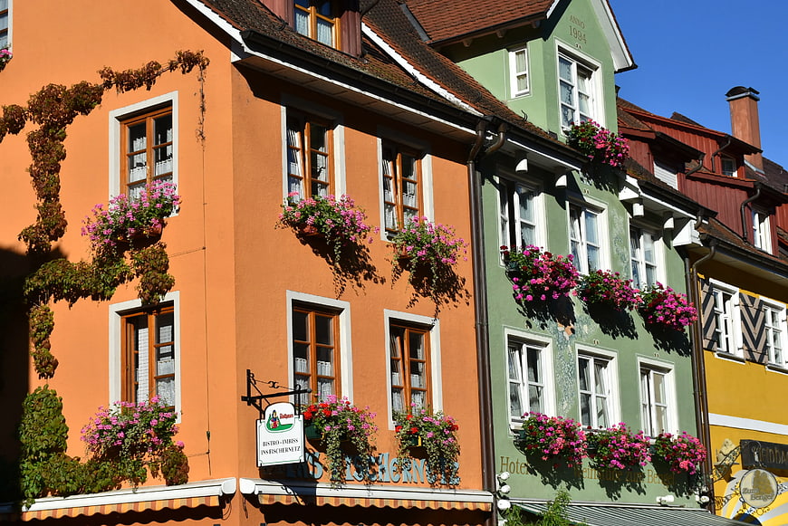 Colorful European buildings with pink flower boxes