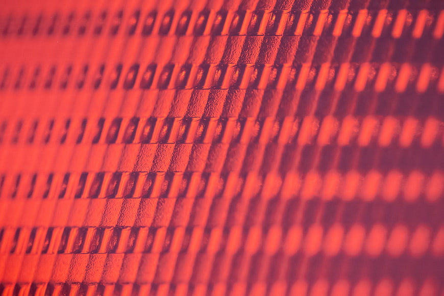 Close-up of red textured surface with diagonal pattern