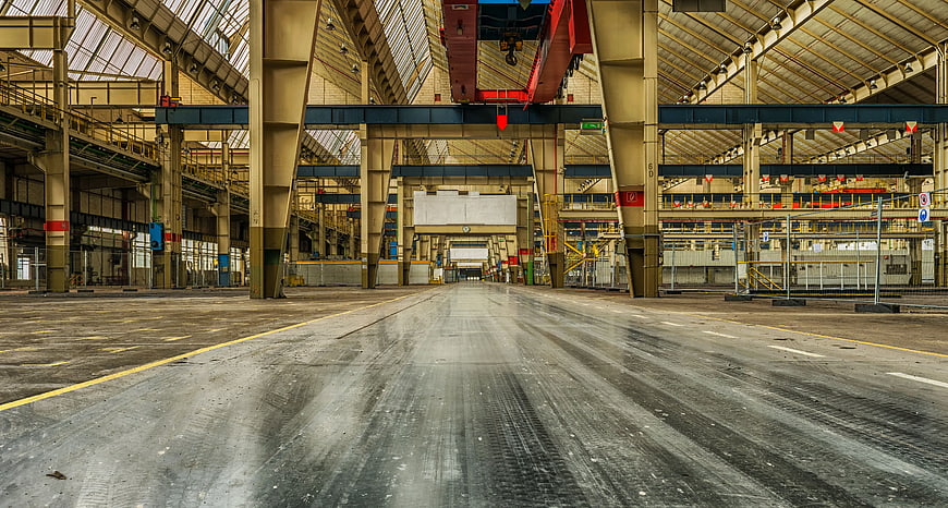 Empty Industrial Warehouse Interior with Overhead Crane