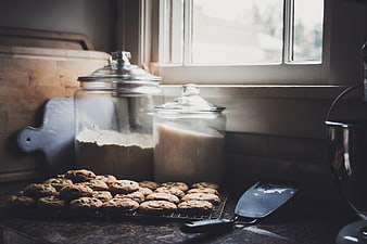 Fresh Baked Cookies on Kitchen Counter with Flour and Sugar Jars