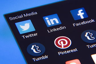 Close-up of social media app icons on a smartphone screen