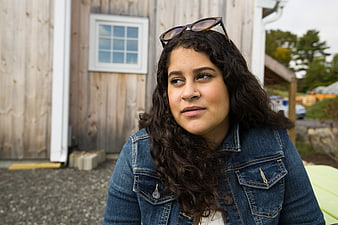 Portrait of Woman with Sunglasses on Head Outdoors