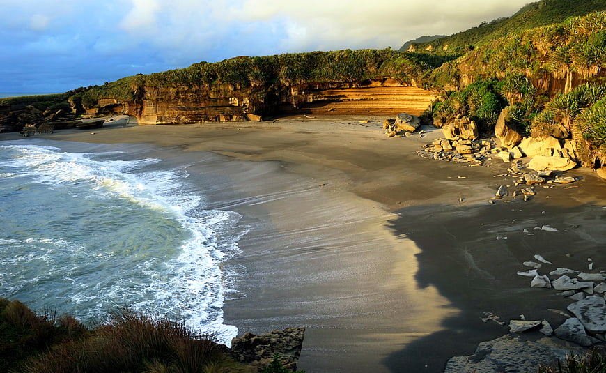 Scenic coastal landscape with sandy beach and cliffs